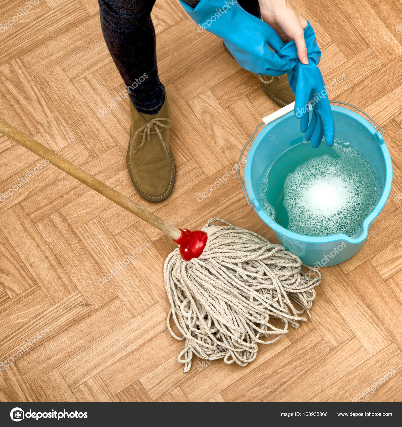 Woman cleaning parquet floor — Stock Photo © katy89 163938366