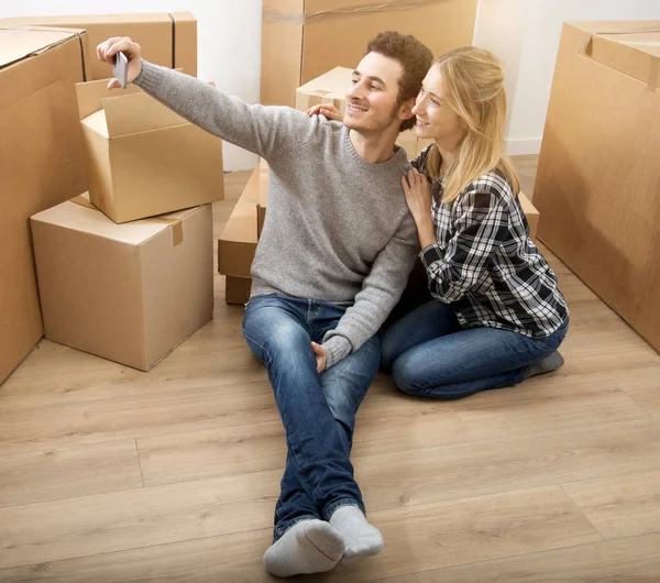 Happy young couple moving to new apartment