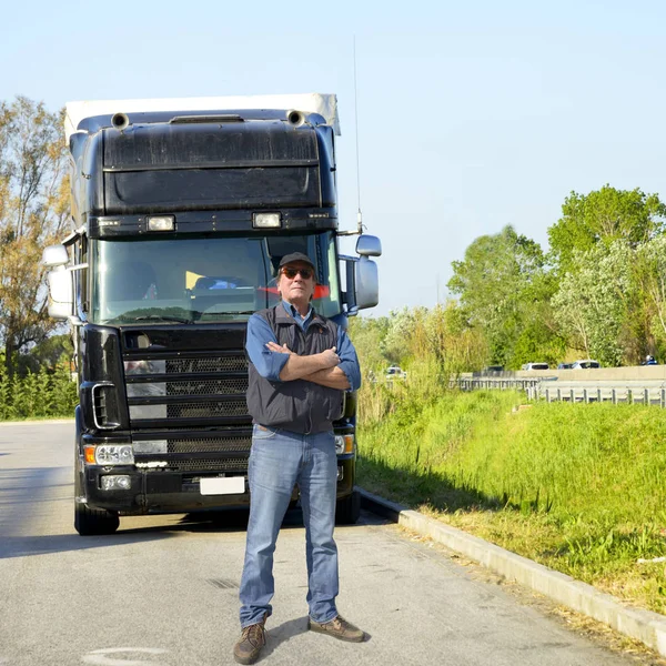 Mature truck driver in a parking area
