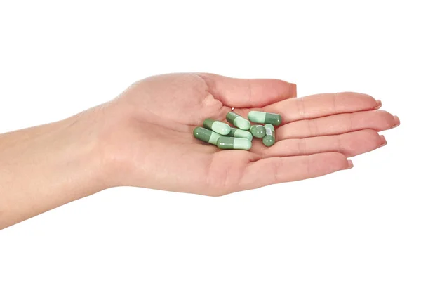 Female hand with colorful pills isolated on white — Stock Photo, Image