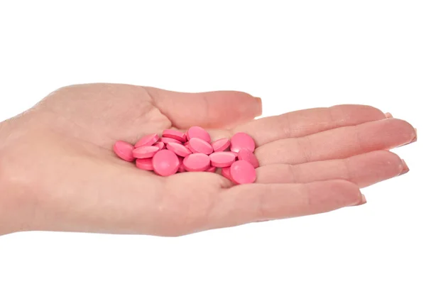 Kvinnlig hand med färgglada piller isolerad på vit — Stockfoto