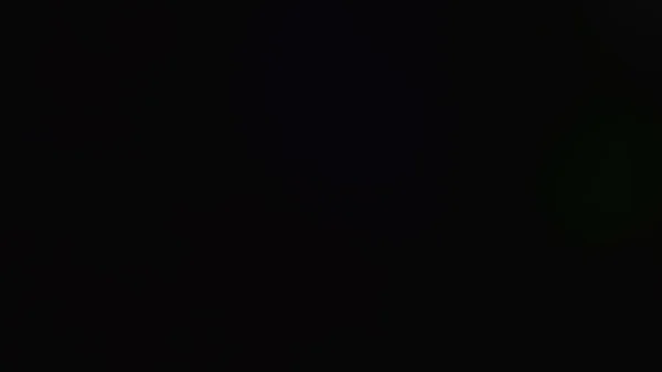 Abstract Dark Background Glowing Light Leaks — Stockfoto