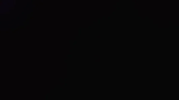 Abstracte Donkere Achtergrond Met Gloeiende Lichtlekken — Stockfoto