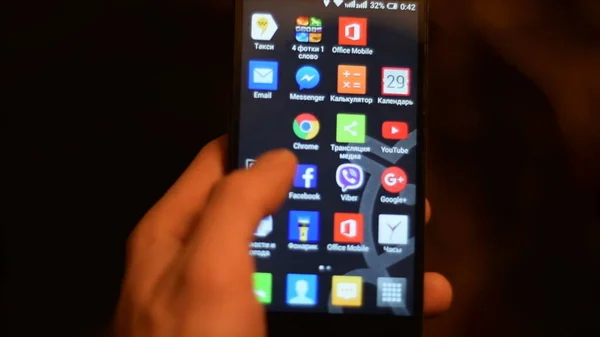 Man Using Touch Screen Smartphone Stockbild