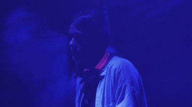 female dj performing on stage in nightclub