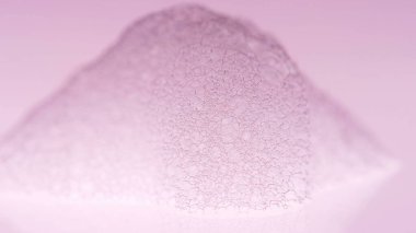 Köpüklü Makro atışı. Temiz, zarif, parlak bir fotoğraf arkaplanı. Köpük köpüklü sabun köpükleri. Dezenfekte fotoğrafı. Köpük Arkaplanı. Kızıl Ejder kamerasına ateş et..