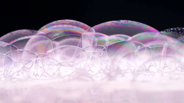 Soap Bubbles Macro shoot. Clean soft elegant bright photo background. Close-up Soap bubbles colors. Washing disinfection. Froth Backdrop. Shoot on Red Dragon camera.