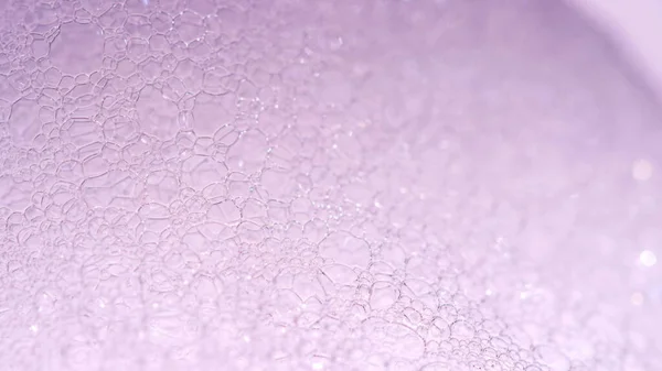 Foam Macro shoot. Clean soft elegant bright photo background. Close-up Soap foam popping bubbles. Washing disinfection photo. Froth Backdrop. Shoot on Red Dragon camera still.