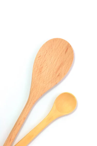 Simple wooden spoons on white background with copy space — Stock Photo, Image