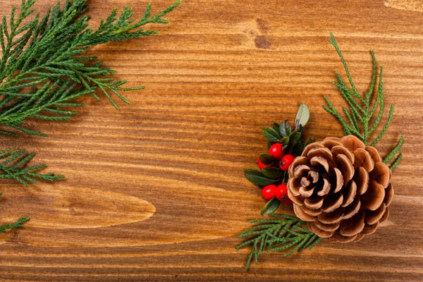 Christmas background pine corn and tree leaves decor on wooden background