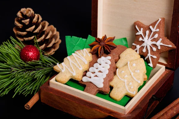 Idea DIY Do it yourself new year and Christmas gift concept butter sugar cookies with royal icing decoration in wood box with copy space