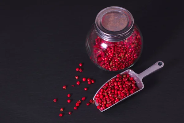 Food Spice concept Organic Pink Peppercorn or pink berry on black background