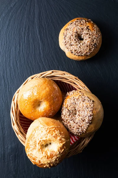 Food bakery concept Homemade organic bagels on black slate stone board with copy space