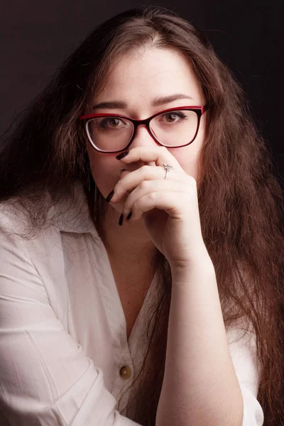 portrait of a plump brunette with long curly hair