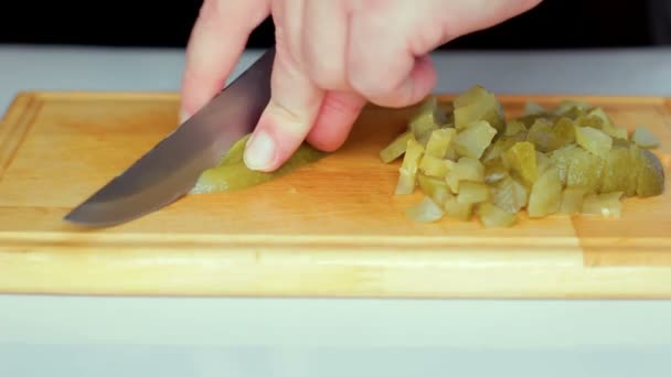 A man cuts with a knife pickles — Stock Footage A man cuts with a knife pickles Stock Footage