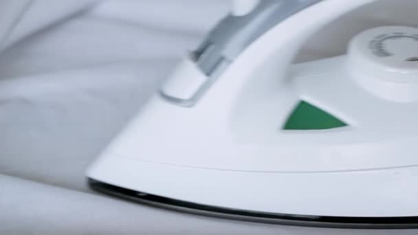Irons white shirt. big Close-up — Stock Footage Irons white shirt. big Close-up Stock Video