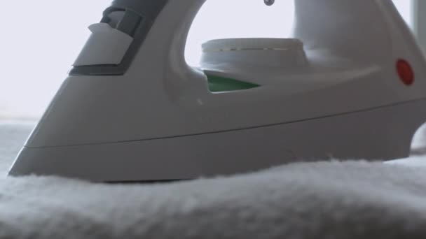 Irons white white fluffy blanket. big Close-up — Stock Footage Irons white white fluffy blanket. big Close-up Royalty Free Stock Video