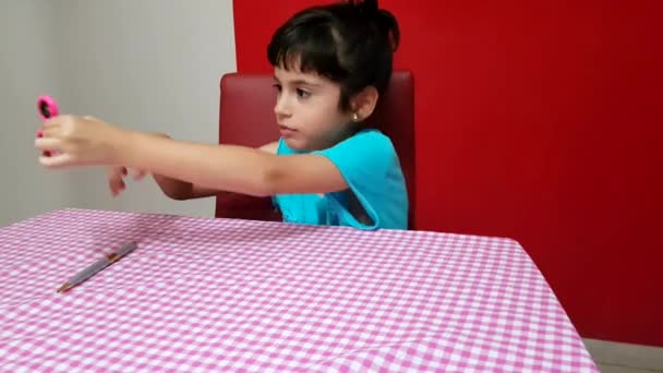 Young Child Plays Spinner — Stock Video