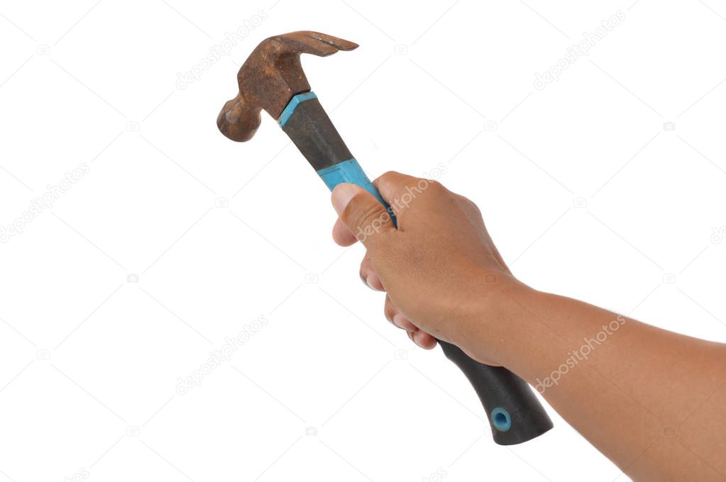 male hands holding a old used hammer on white background