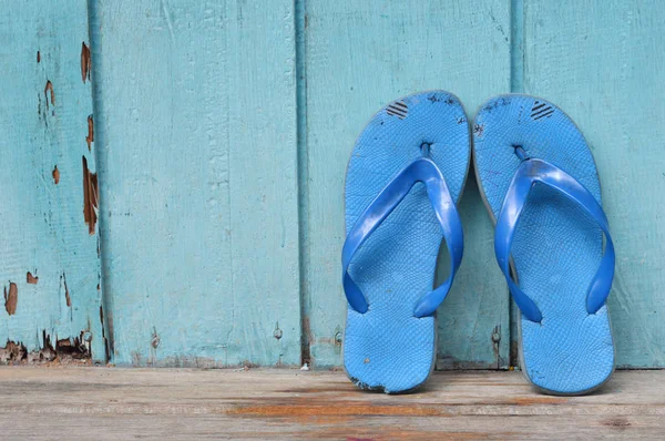 Old Used Blue Flip Flops Wooden Wall — Stock Photo, Image