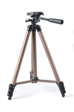 beyaz zemin üzerinde kamera tripod