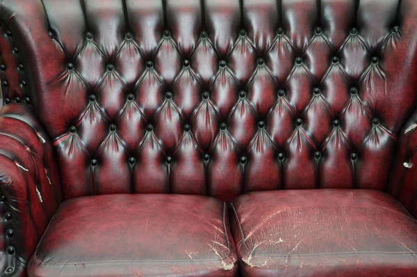 texture and pattern of red dark leather seat upholstery