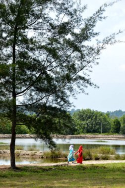 TARAKAN, INDONESIA - 30th MAY 2016 : Muslim girls by the pool