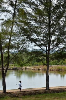 TARAKAN, INDONESIA - 30th MAY 2016 : Muslim boys running by the pool