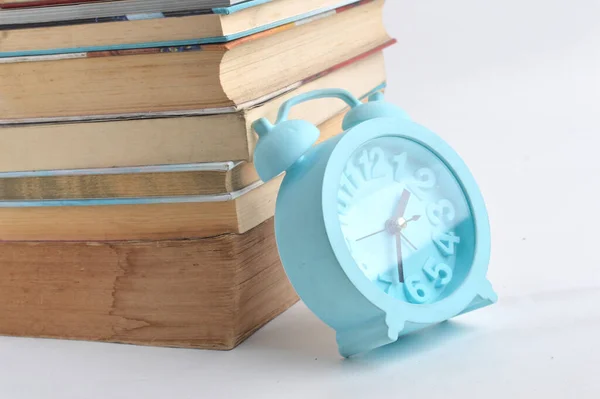 Stack Books Blue Alarm Clock White Background — Stock Photo, Image