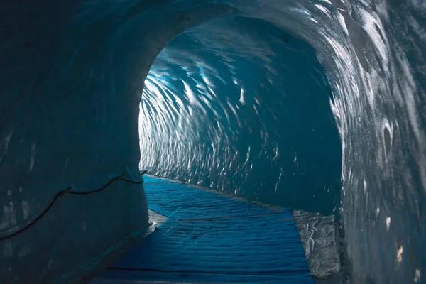 The tunnel in old glacier Stock Photo