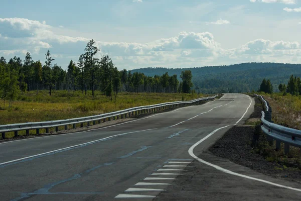 The urban road with bad asphalt covering — Stock Photo, Image