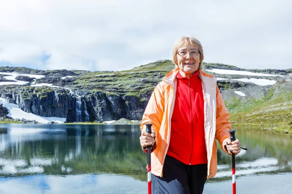 Senior tourist woman hiking. — Stock Photo, Image