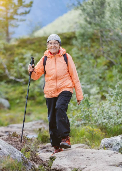 Senior tourist woman hiking. — Stock Photo, Image