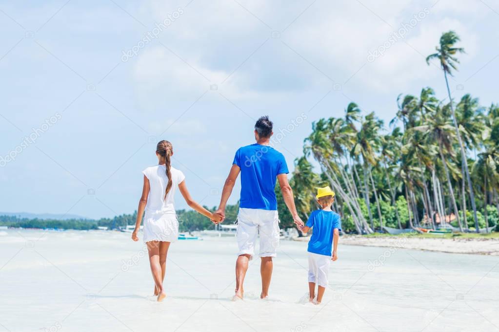 Family of three having fun at the beach