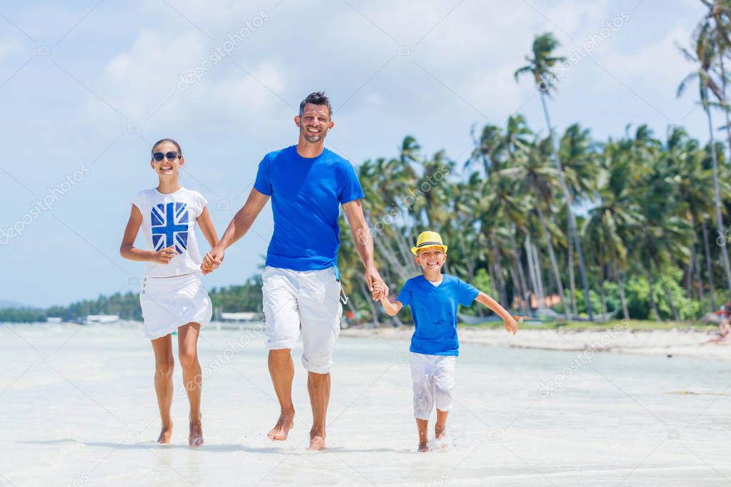 Family of three having fun at the beach