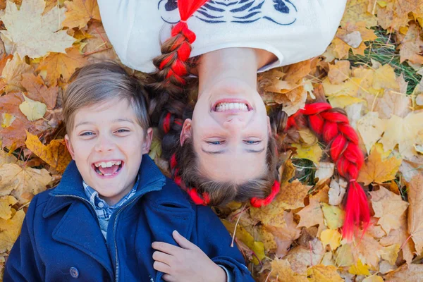 Happy kids having fun in autumn park — Stock Photo, Image