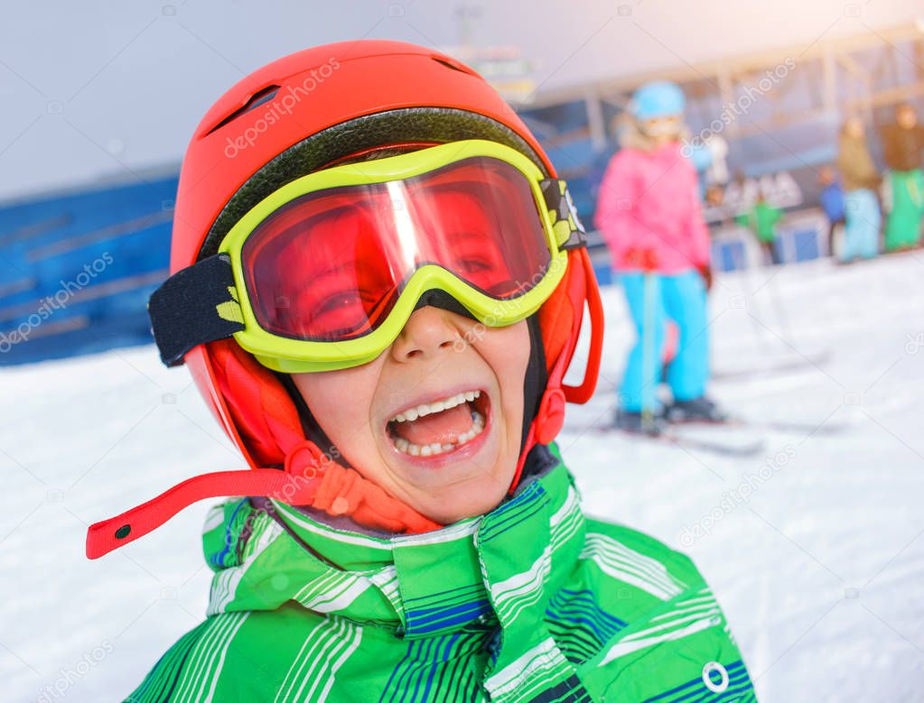 Skier boy in a winter ski resort.