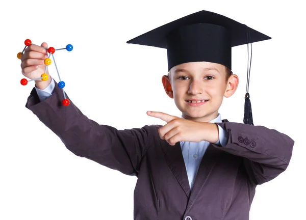 Kleiner Junge mit akademischem Hut — Stockfoto