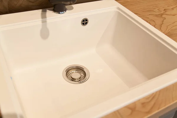 Interior of modern kitchen and ceramic sink and drain — Stock Photo, Image