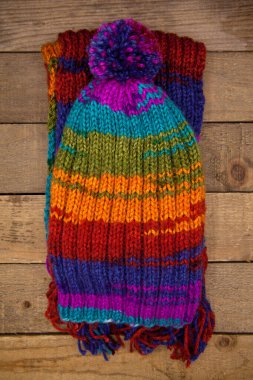 Handmade wool knitted winter colored hat and scarf