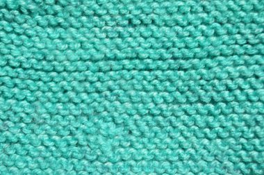 Handmade knitted fabric turquoise wool background texture