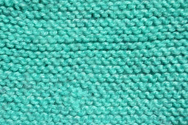 Handmade knitted fabric turquoise wool background texture — Stockfoto