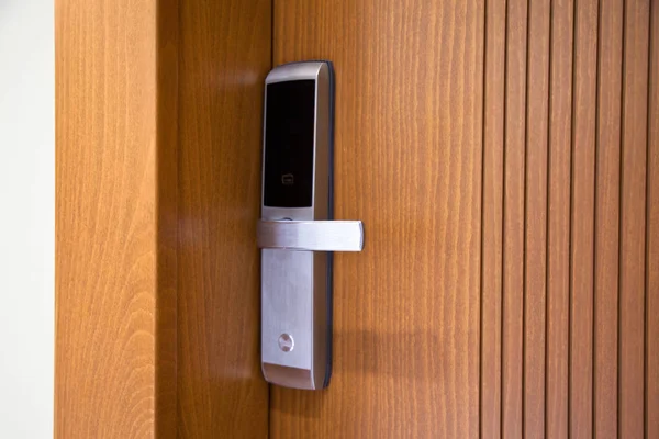 Modern wooden looking steel door, electronic security lock syste — Stockfoto