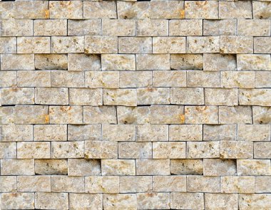Bej rengi mermer duvar dikdörtgen, pürüzsüz sıralanmış.