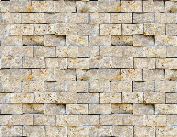 Snijden beige marmeren muur rechthoekig, naadloos opgesteld — Stockfoto