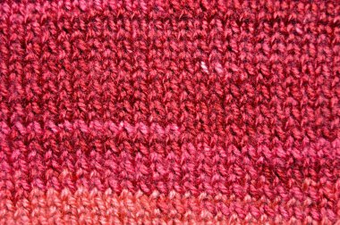 Handmade knitted fabric red wool background texture