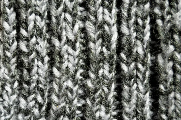 Handgjort stickat tyg grå ull bakgrund textur — Stockfoto
