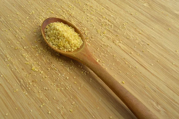 Dry Cracked Wheat Daliya Grains Wooden Spoon Bamboo Cutting Board — Stock Photo, Image