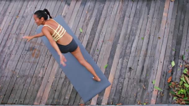 Asian young woman doing hatha yoga in abandoned temple — Stock Video