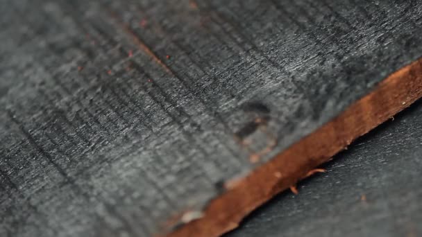 Home decorator burning wood planks — Stock Video